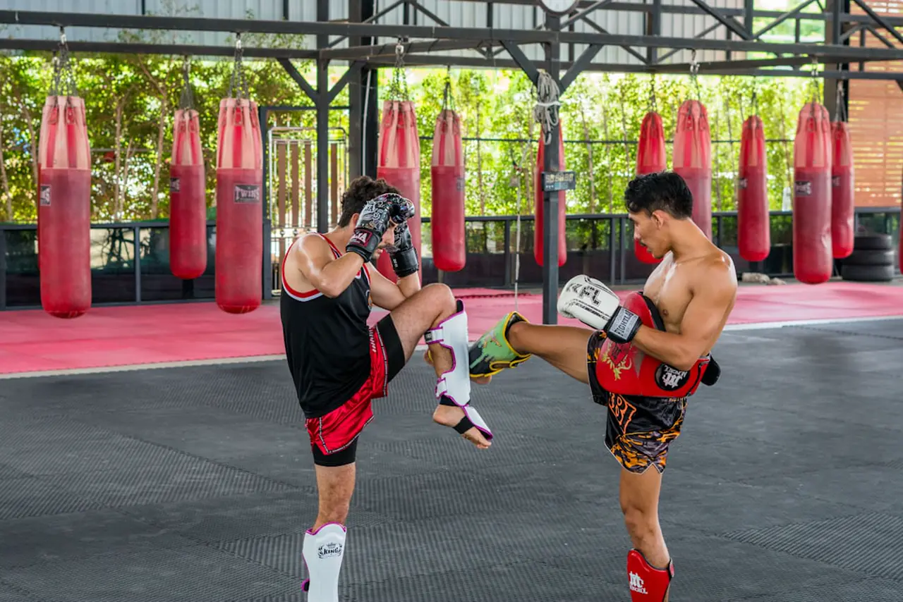 Muay Thai kickboxing training with pads - beginner-friendly 1-on-1 coaching at KilaFight Camp Ottawa